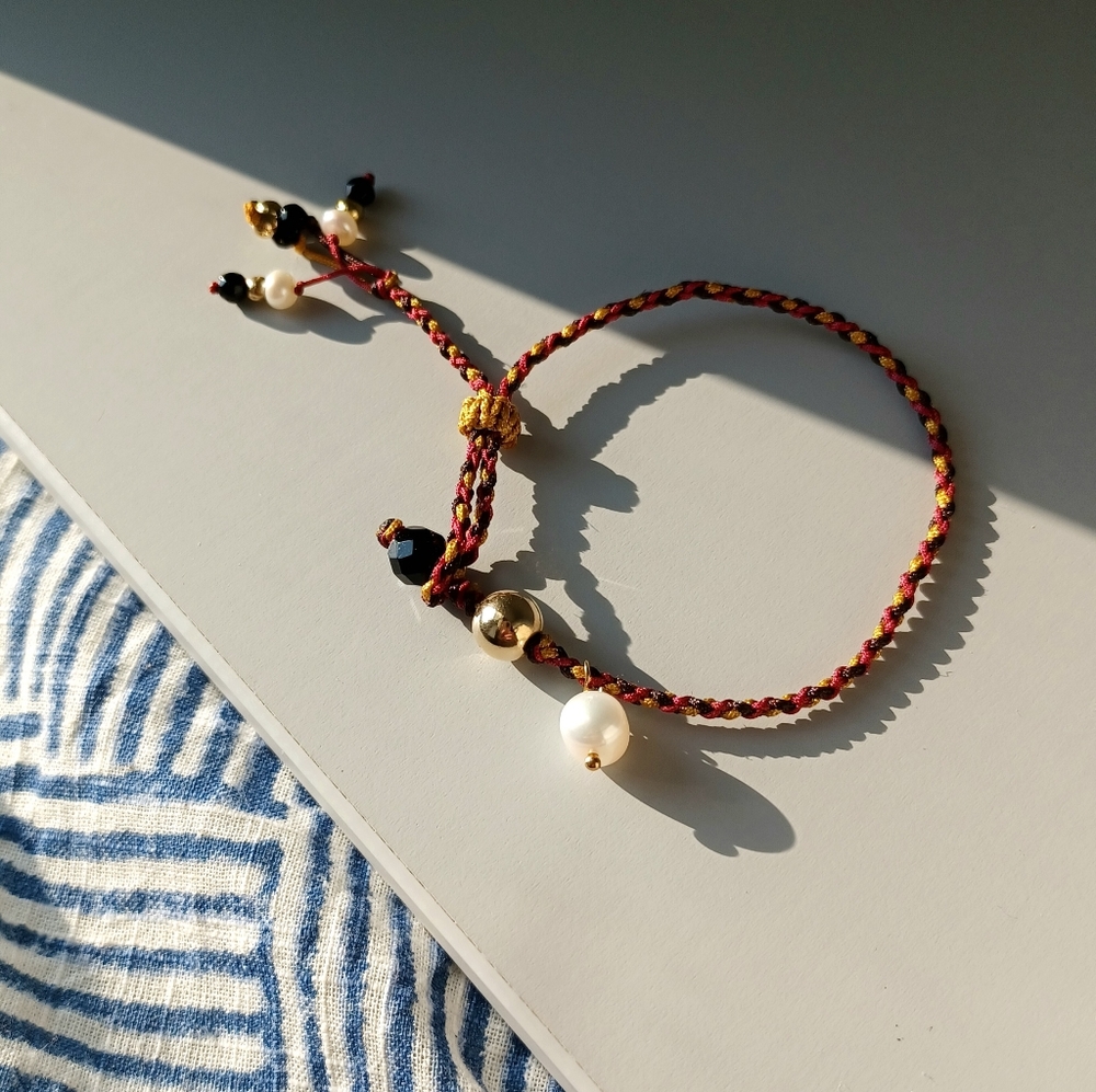 Hand -woven 14 k gold over sterling silver and freshwater pearl bracelet
